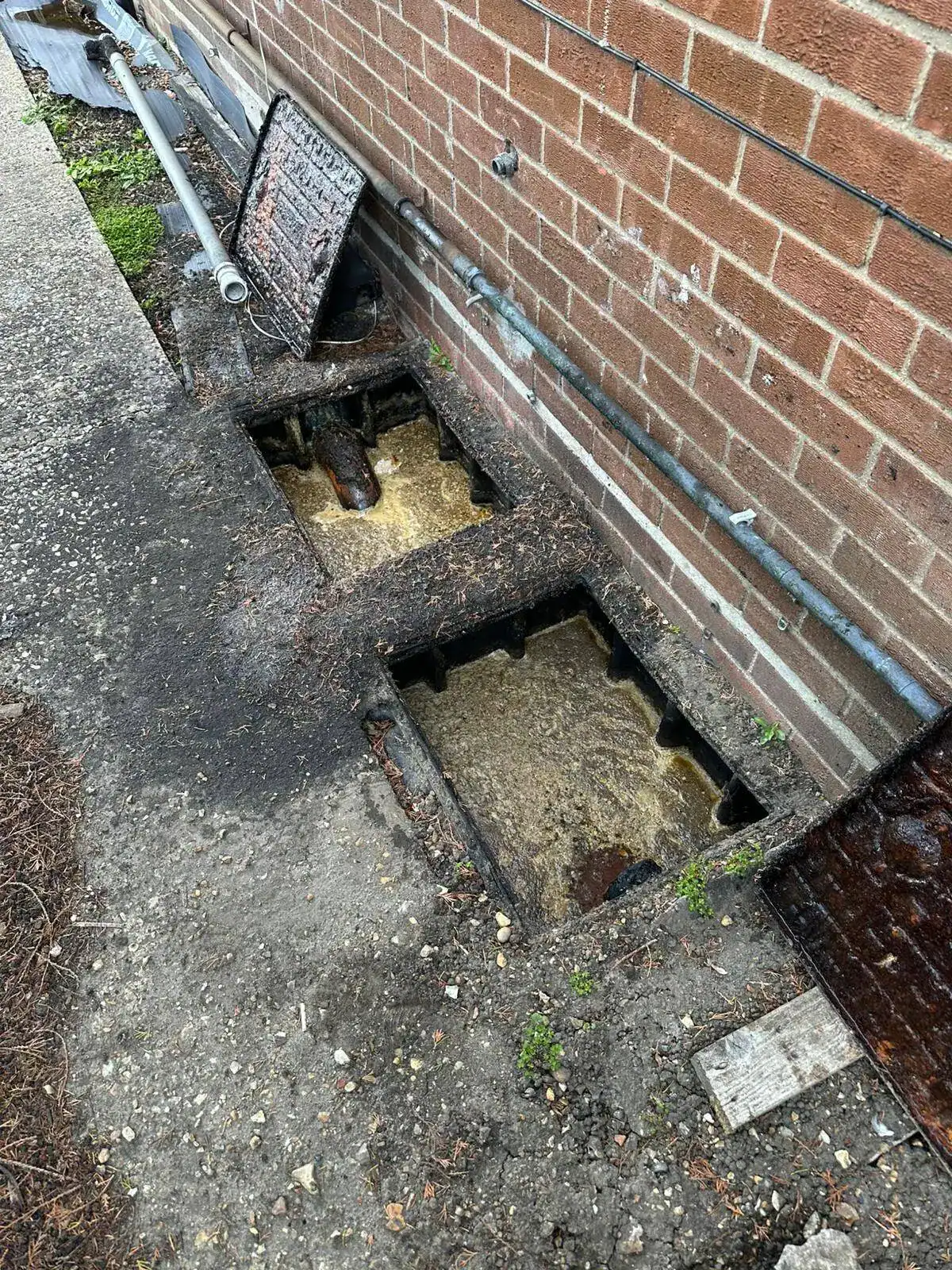 Commercial grease trap opened for inspection and cleaning as part of our Grease Trap Management King's Lynn service, helping prevent blocked drains and maintain efficient wastewater flow.