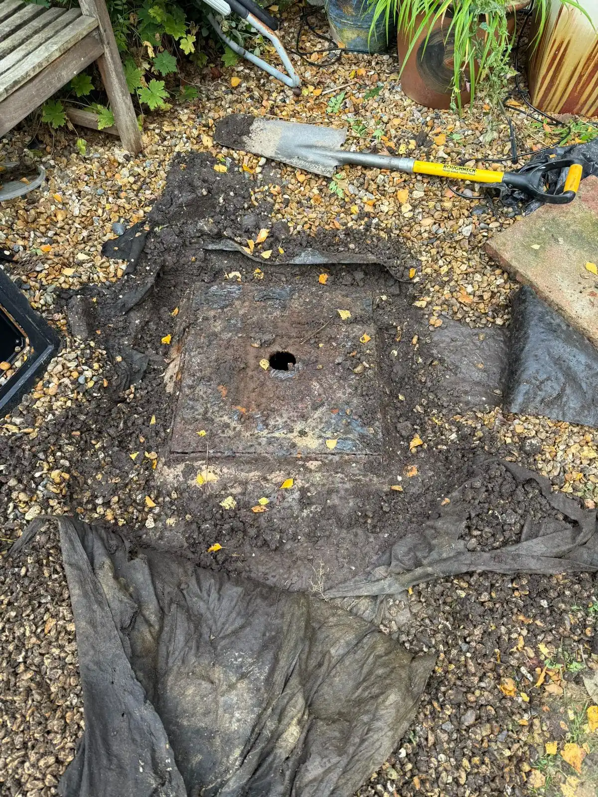 Drainage access cover exposed during gully cleaning work in King's Lynn.