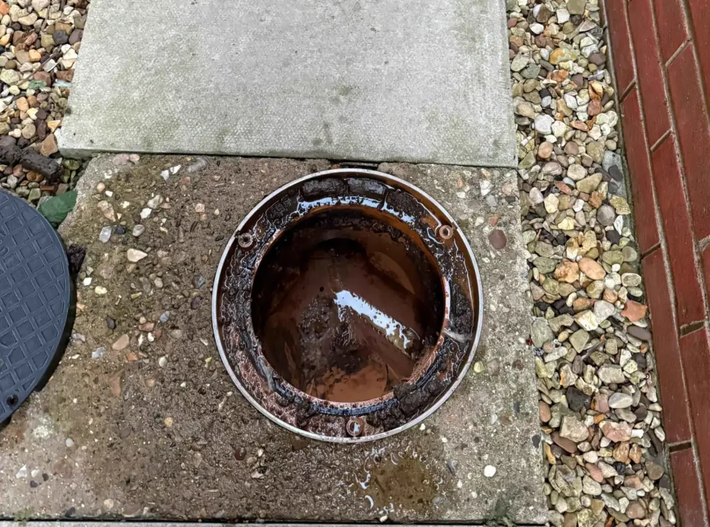 Drainage Services King's Lynn with a drainage inspection chamber during maintenance work.