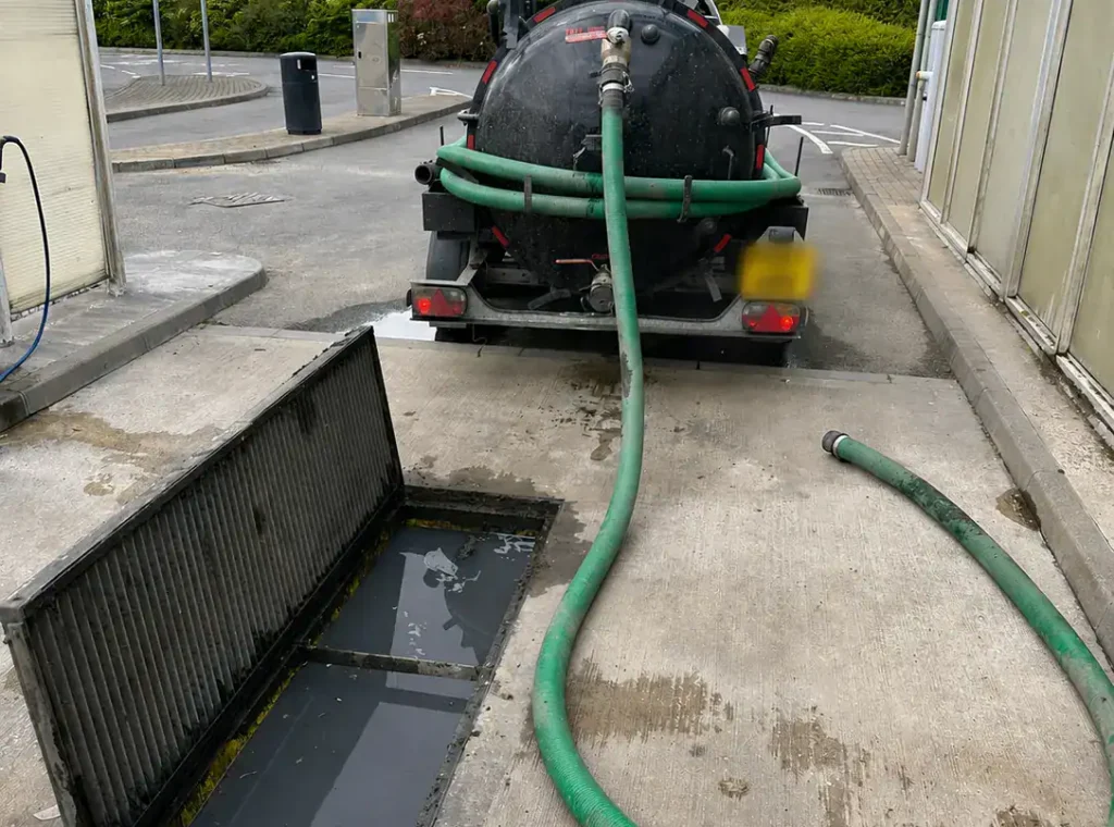 Drainage Services King's Lynn with a vacuum tanker cleaning a commercial drainage system.